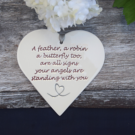 A Feather, a robin Quote Sign